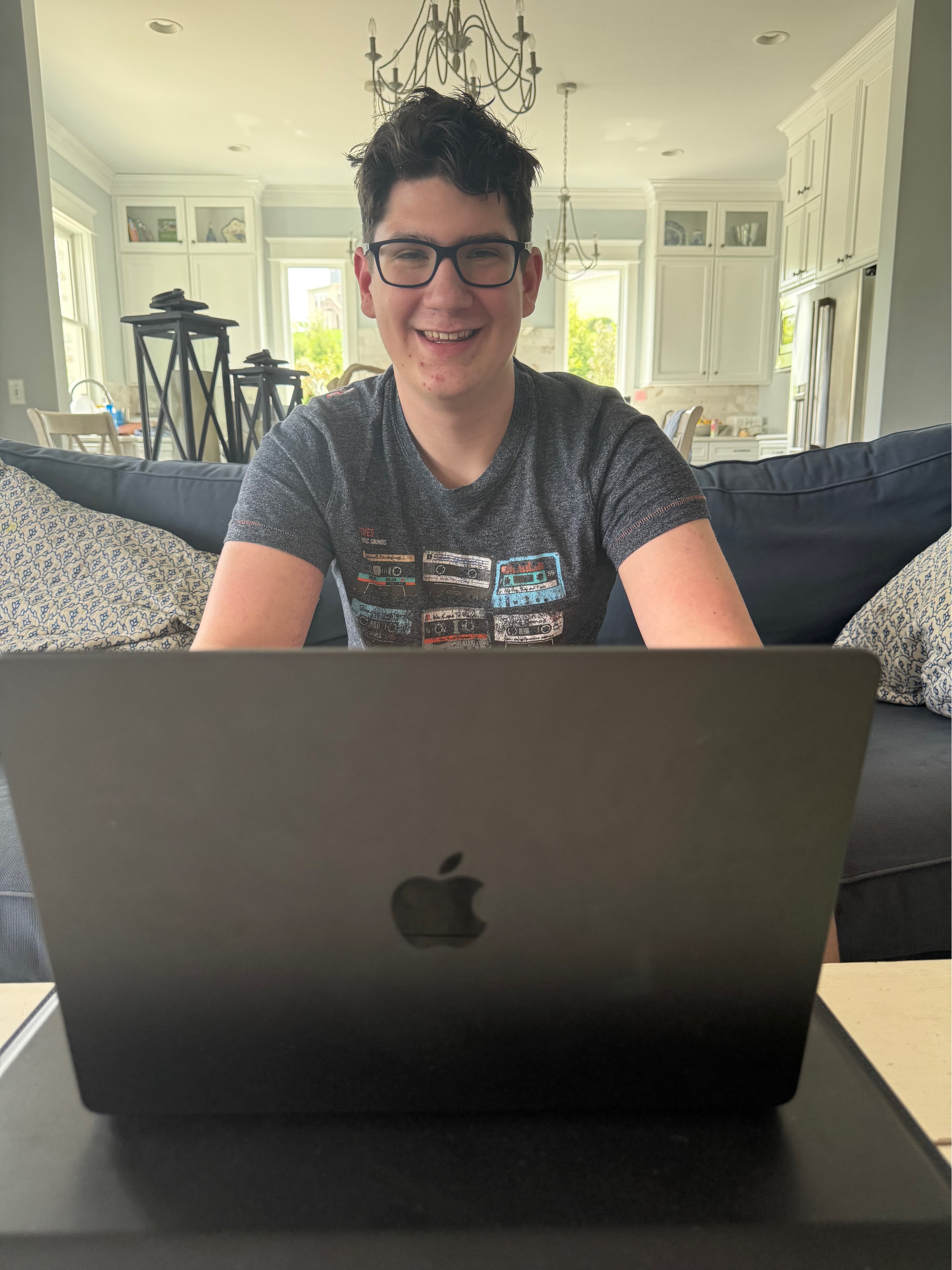 Me smiling at my laptop